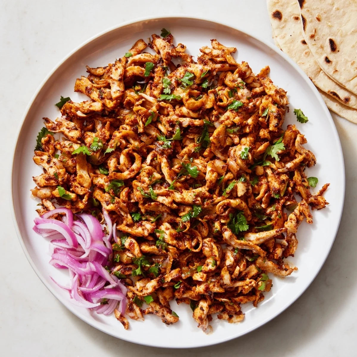 Baked oyster mushrooms seasoned with Mexican spices served on rustic corn tortillas