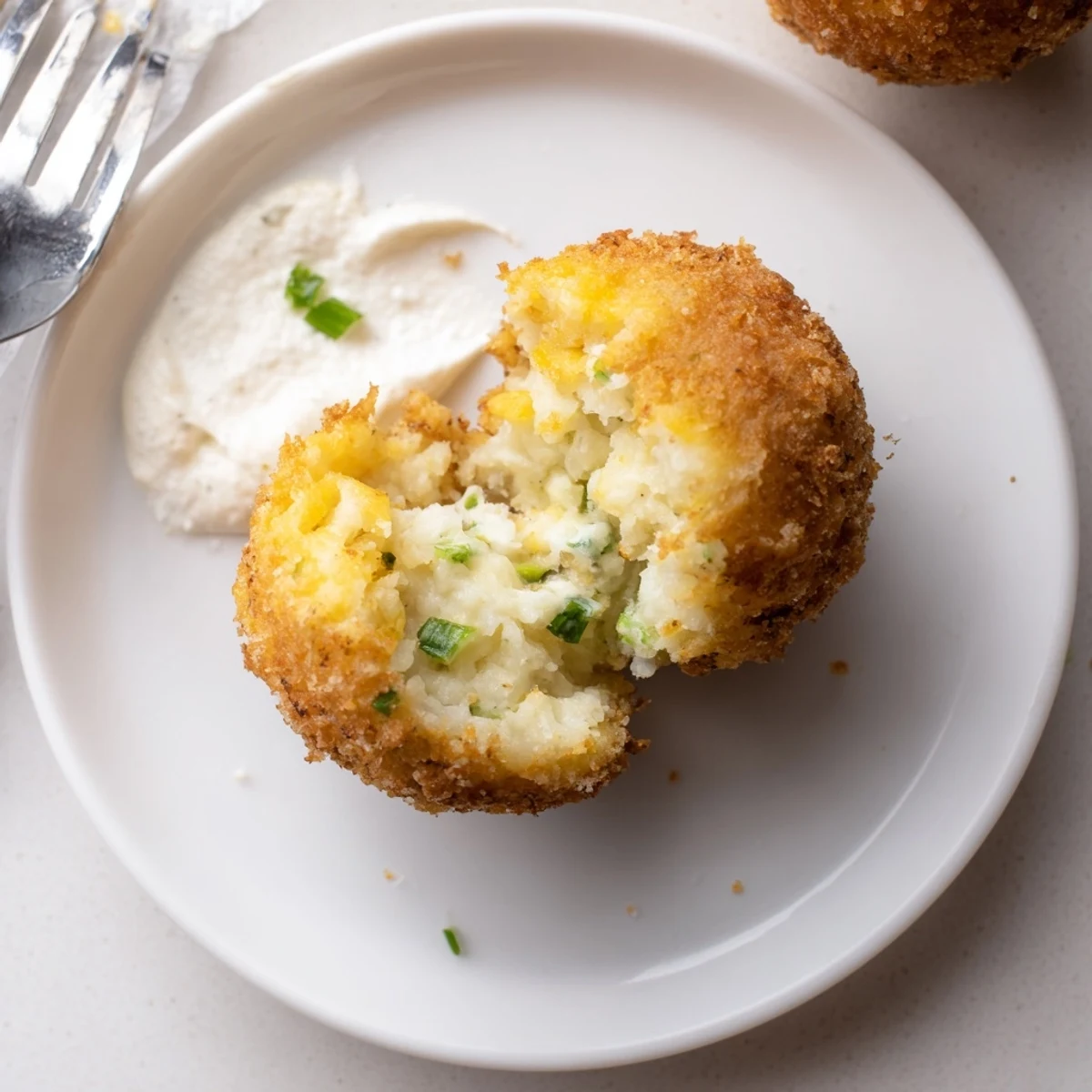 Serving suggestion: Fried Mashed Potato Balls with spicy ketchup and cool sour cream.