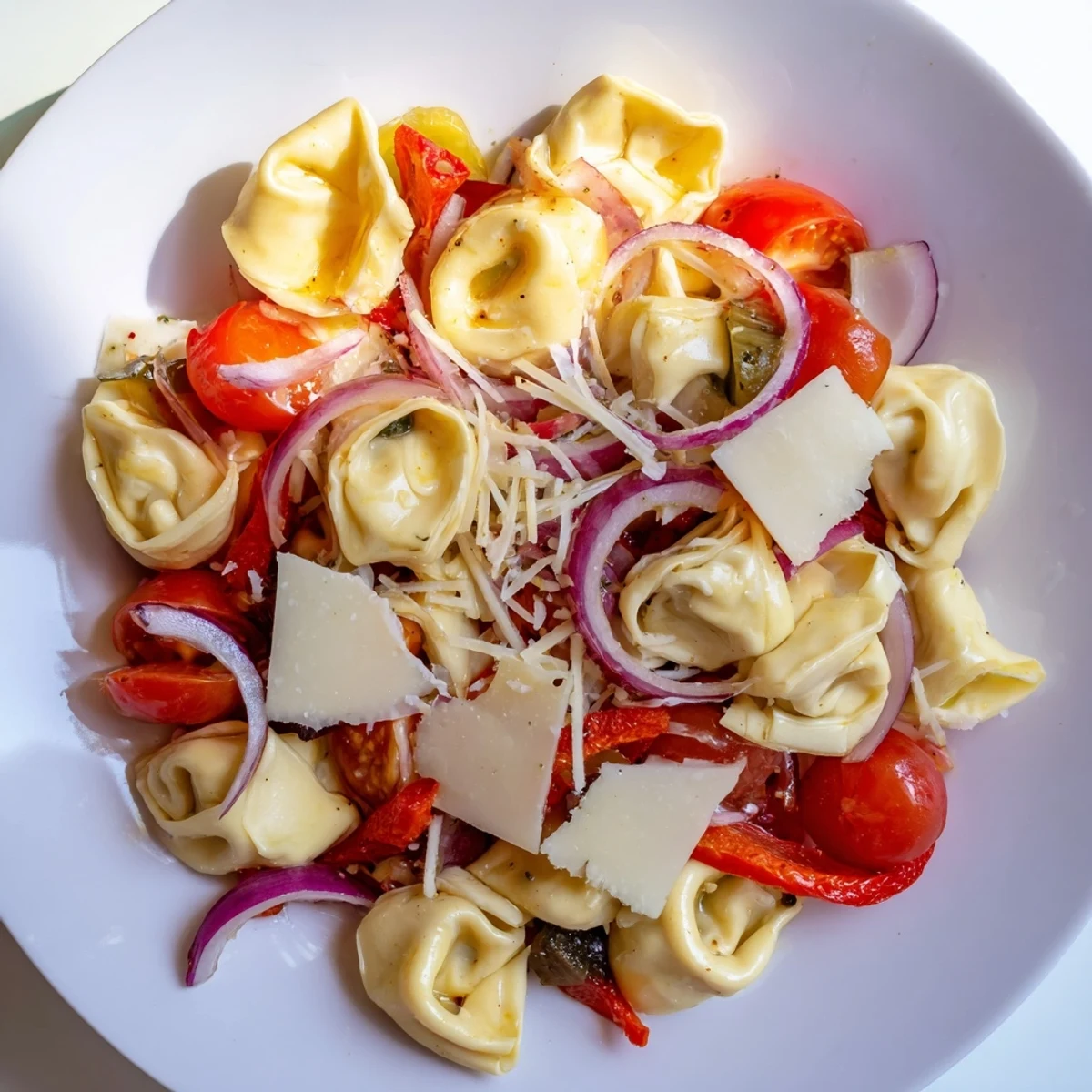 Vibrant Italian-American pasta salad with cheese tortellini, roasted red peppers, and tangy homemade dressing
