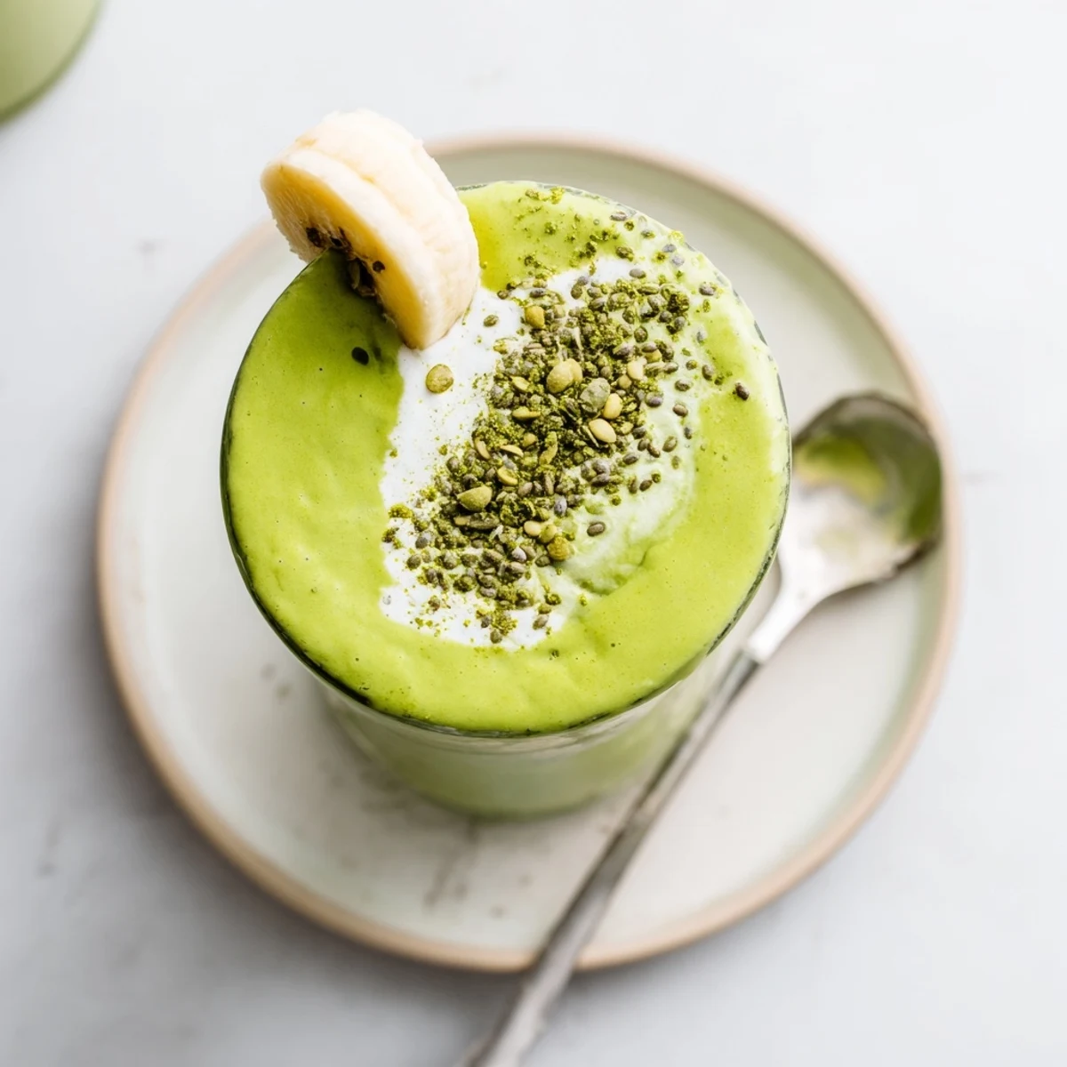 Two glasses of chilled Matcha Smoothie garnished with chia, ideal breakfast