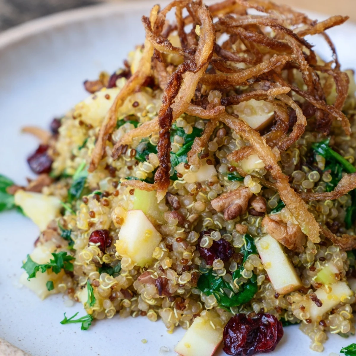 Fluffy quinoa tossed with crisp diced apples cranberries and tangy honey mustard dressing